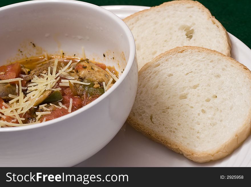 Serving of penne spaghetti white dishes nice reddish colors. Serving of penne spaghetti white dishes nice reddish colors