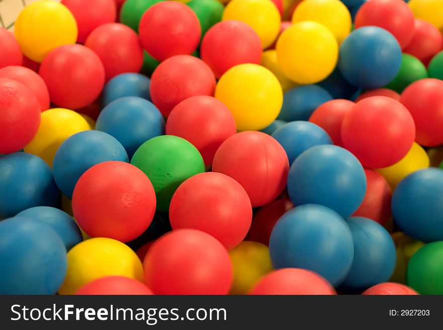 Background of colored balls, focuss is on the red bal in the middle. Background of colored balls, focuss is on the red bal in the middle