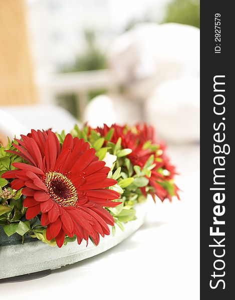 Bouquet with red flowerses on the white background