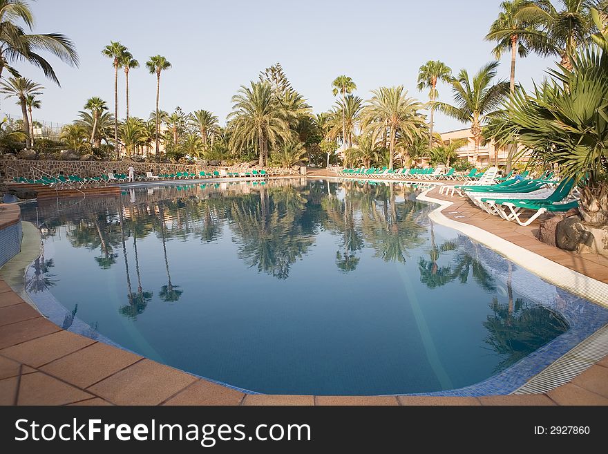 A beautiful pool and sun loungers. A beautiful pool and sun loungers