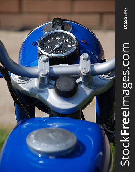Old blue motorcycle close-up - speedometer
