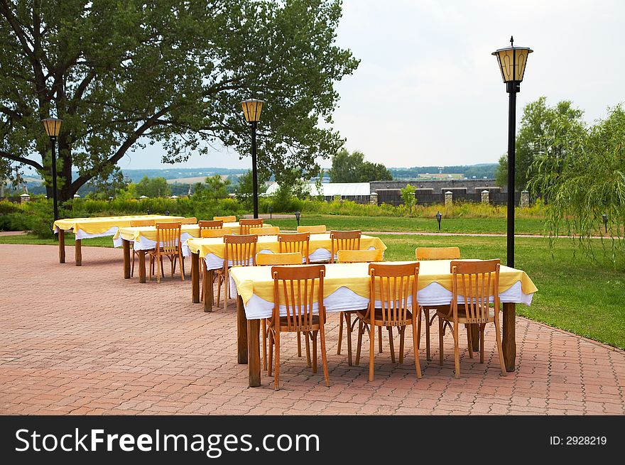 Tables and chairs in cafe on fresh air