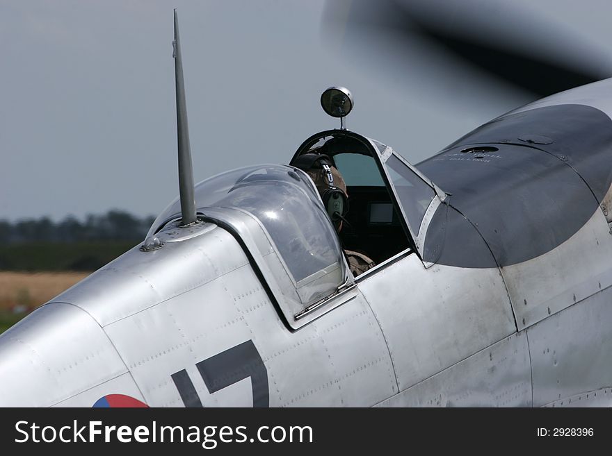 Supermarine Spitfire's opened cockpit and started engine.