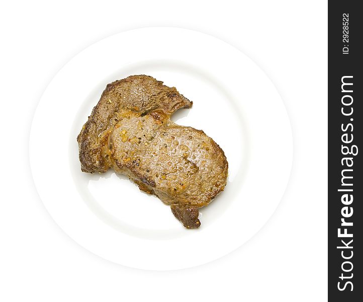 Fresh grilled rib-eye steak isolated on a white background. Fresh grilled rib-eye steak isolated on a white background