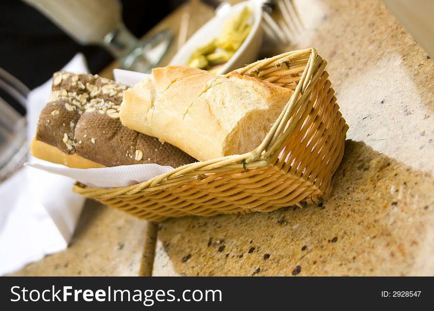 Freshly baked bread in basket on a table