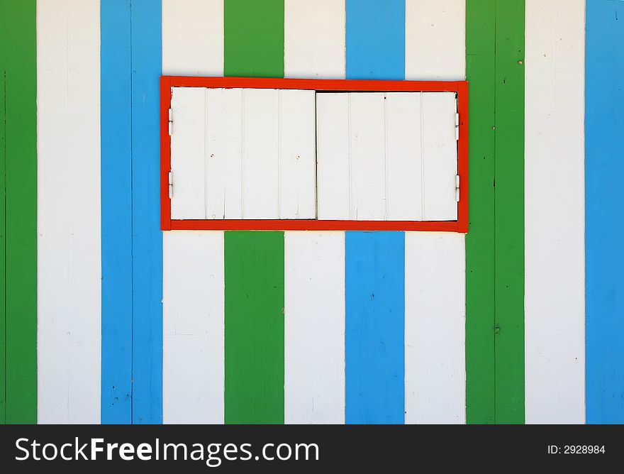 Blue and green wooden stripes texture with a window