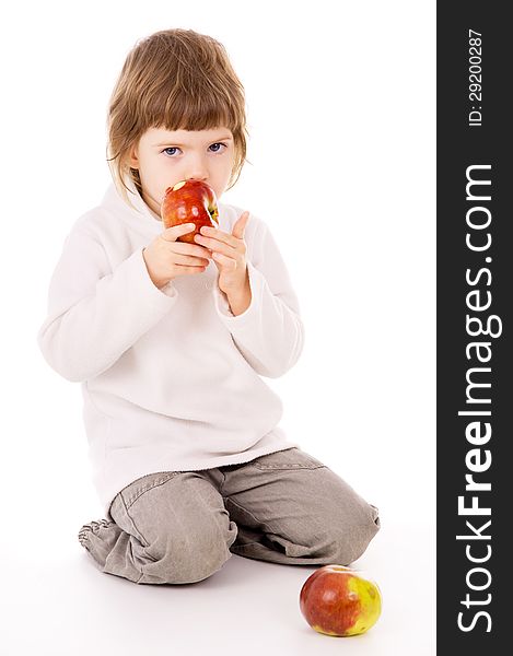 The little girl eat apples  on white background