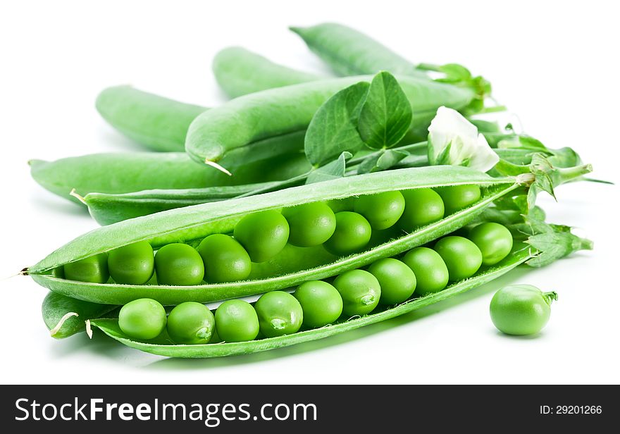 Pods of green peas with leaves on white background.
