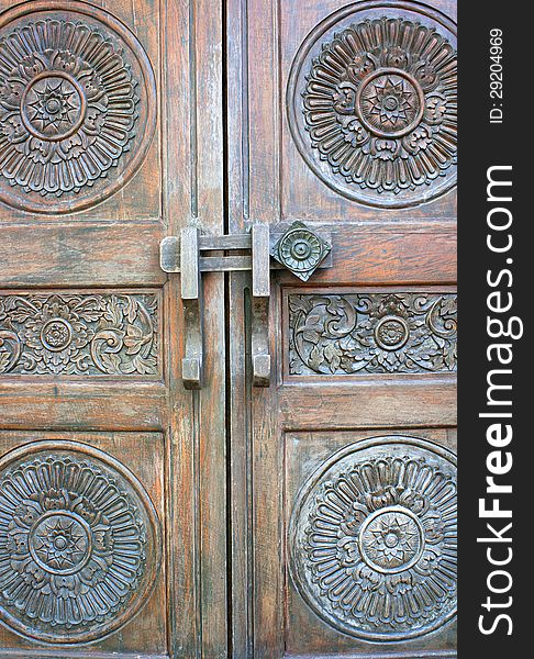 Old ancient gate. Brown antique wooden bolts. Old ancient gate. Brown antique wooden bolts.