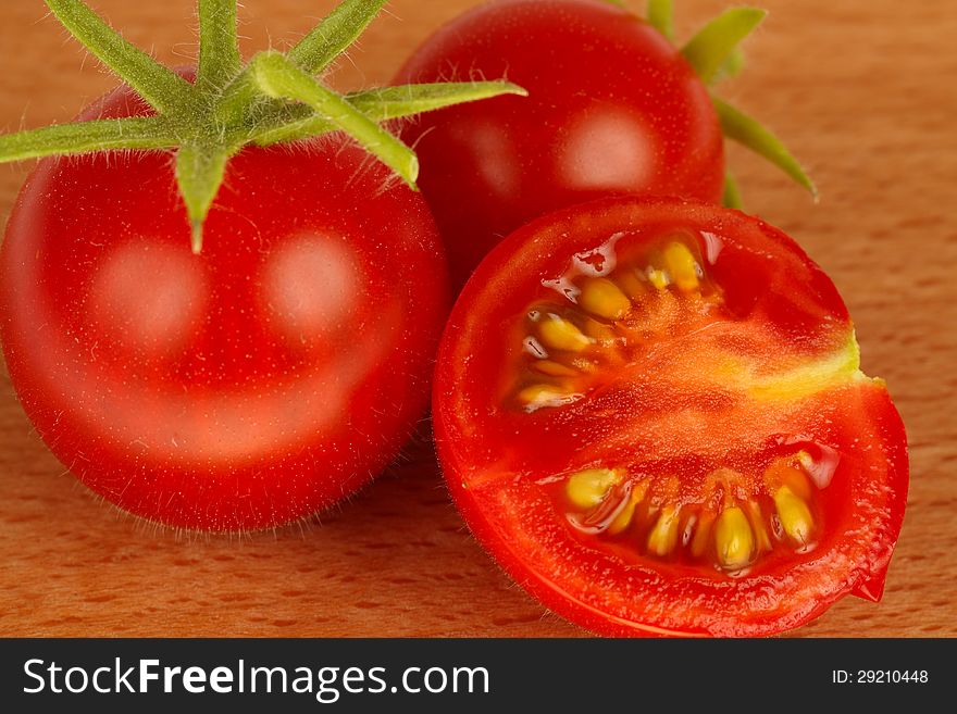 Red tomatoes in wood background