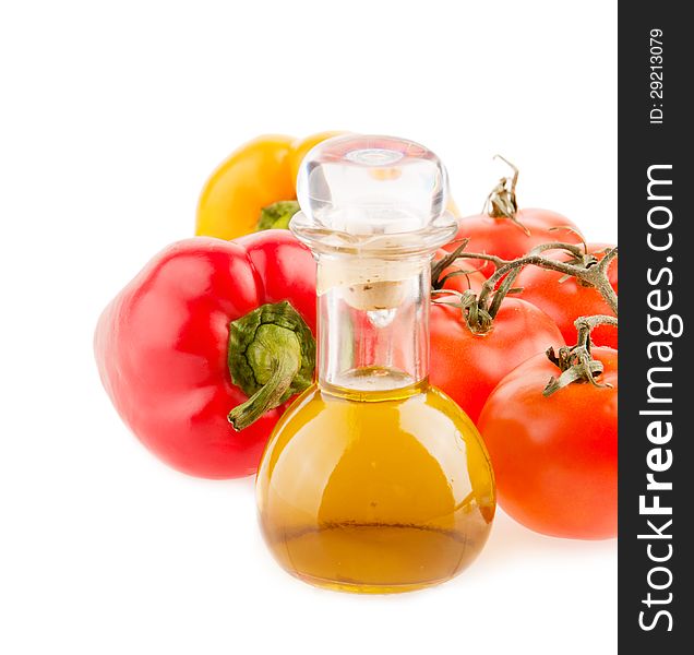 Bottle with olive oil ,tomatoes and peppers on a white background