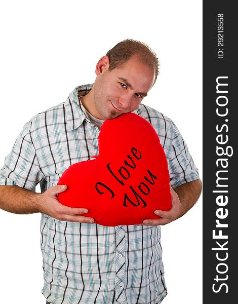Young man holding heart - isolated. Young man holding heart - isolated