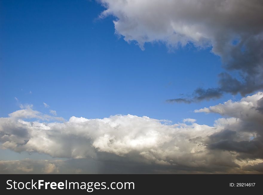 Dramatic Clouds Against A Blue Sky Background