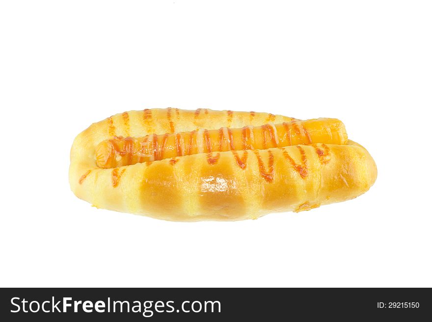 Baked bread and sausage isolated on white background