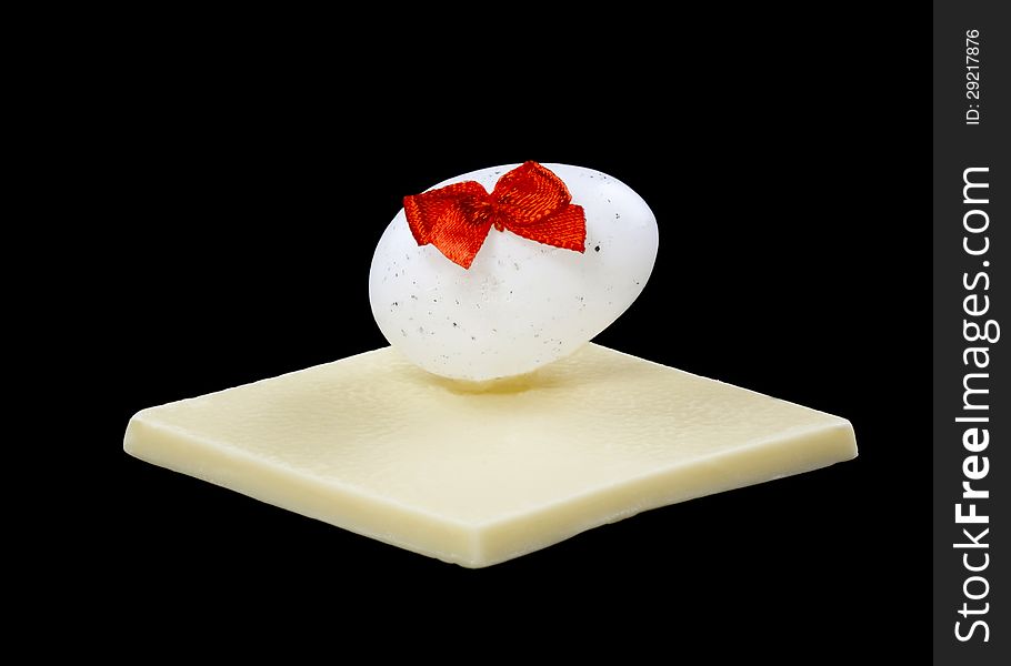 White chocolate and Easter egg isolated on a black background