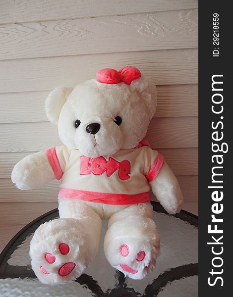 White teddy bear have a Pink ribbon. White teddy bear have a Pink ribbon.