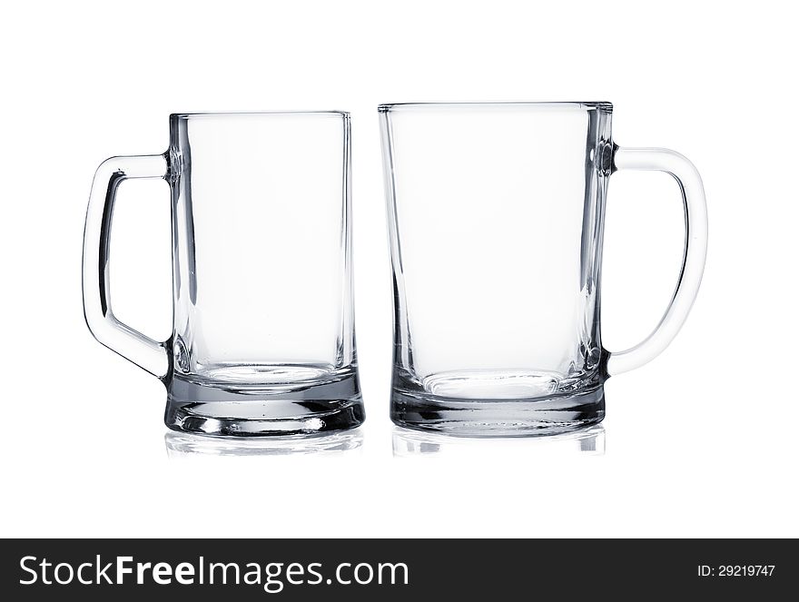 Two empty beer mugs on white