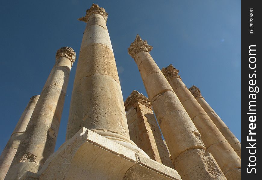 This photo was taken in jerash jordan, of the temple of artemis.  as most days are in the middle east, there was not a cloud in the sky.  i was awed by how impressive the pillars looked today, and could only imagine how inspiring they were when this was built. This photo was taken in jerash jordan, of the temple of artemis.  as most days are in the middle east, there was not a cloud in the sky.  i was awed by how impressive the pillars looked today, and could only imagine how inspiring they were when this was built.