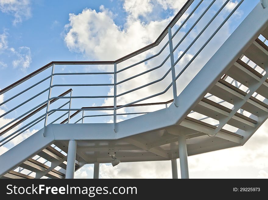 Metal staircase with blue sky. Metal staircase with blue sky