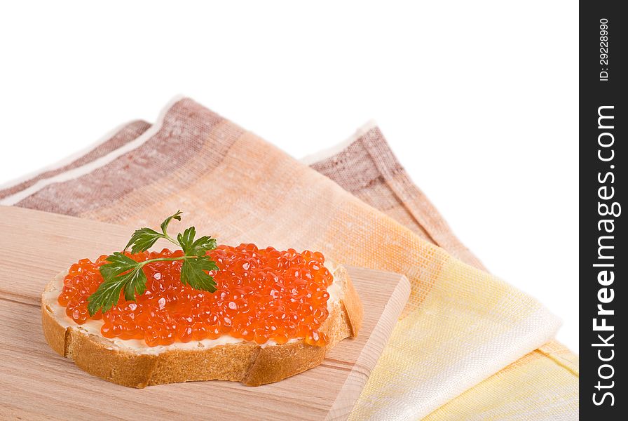 Bread with red caviar and parsley