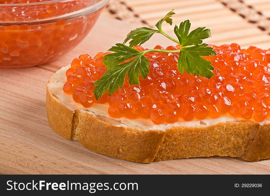 Bread with batter and red caviar. Bread with batter and red caviar