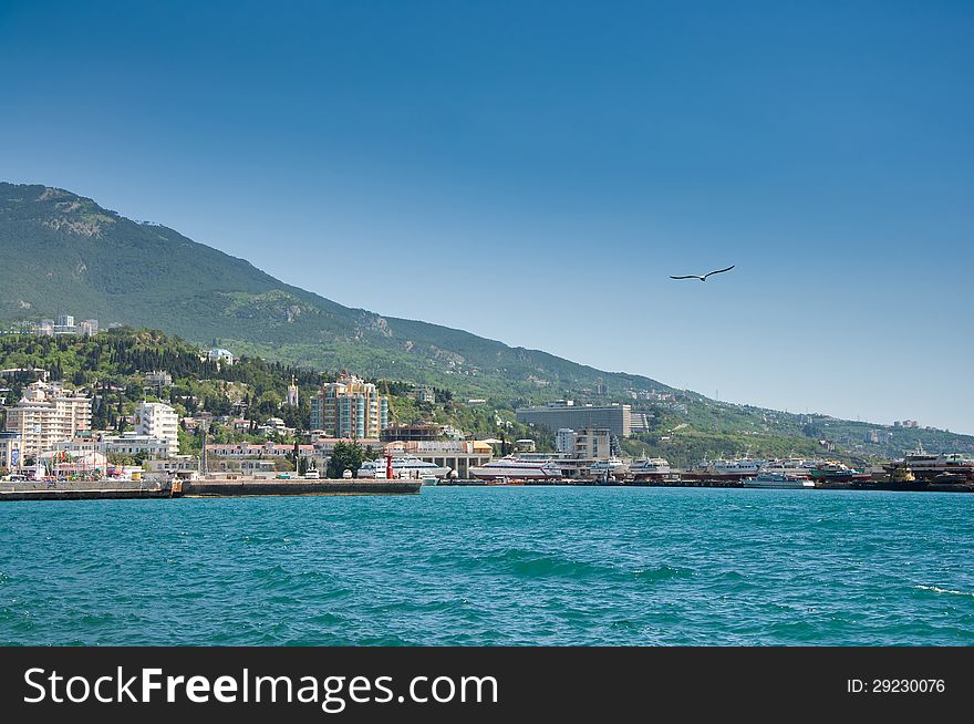 Black Sea, Yalta city in Crimea, Ukraine. Bright summer day. Black Sea, Yalta city in Crimea, Ukraine. Bright summer day.