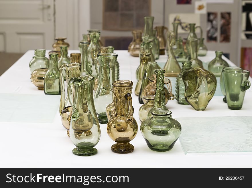 Many glass vases on a table