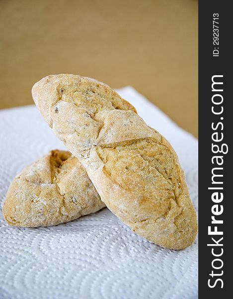 Fresh bread on brown background