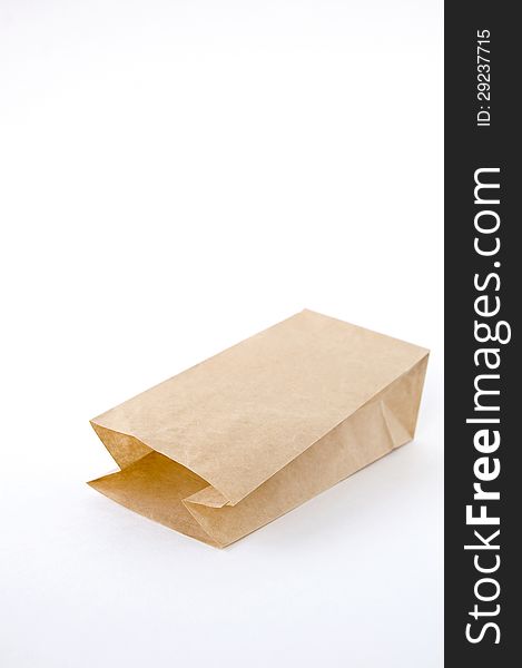 Open brown paper bag on white background