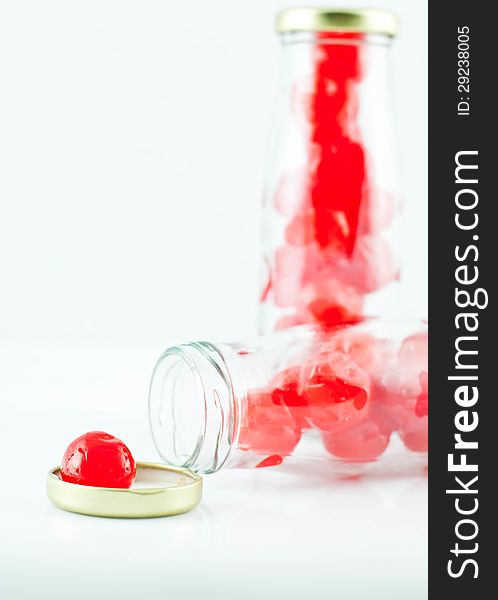 Glass of cherry compote on a white background. Glass of cherry compote on a white background