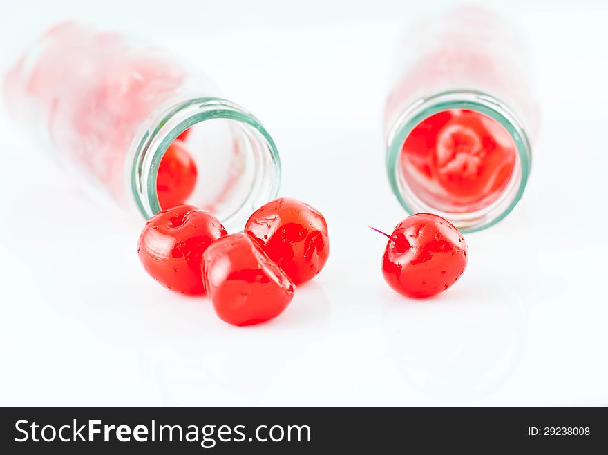 Glass of cherry compote on a white background. Glass of cherry compote on a white background