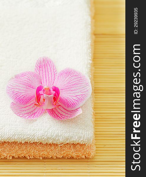 Towels and orchid flower