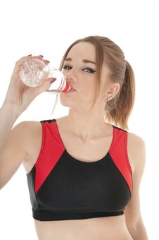 Beautiful  Happy Athletic  Girl Drinking Water. Stock Photo