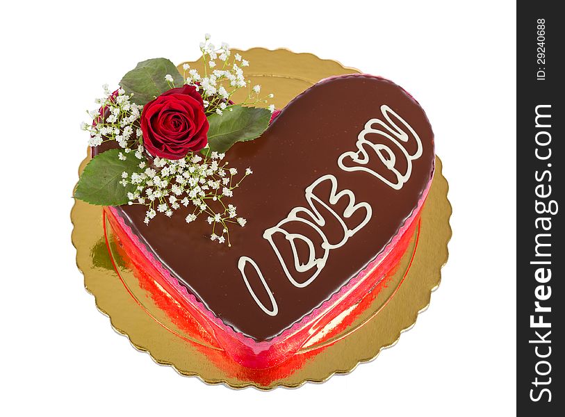 Heart shaped chocolate cake with rose and I love you inscription, isolated. Heart shaped chocolate cake with rose and I love you inscription, isolated.