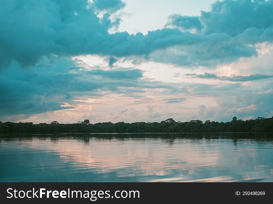 Beautiful view of clouds and trees reflecting on the water. beautiful background
