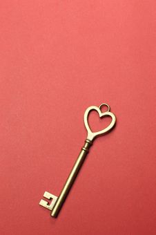 One Heart Shape Gold Key - Vertical. Royalty Free Stock Photography