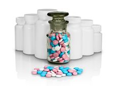 Small Group A Pill Against Small Bottles With Pills. Stock Photos Small Group A Pill Against Small Bottles With Pills. Stock Photos