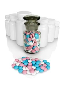 Small Group A Pill Against Small Bottles With Pills. Stock Image