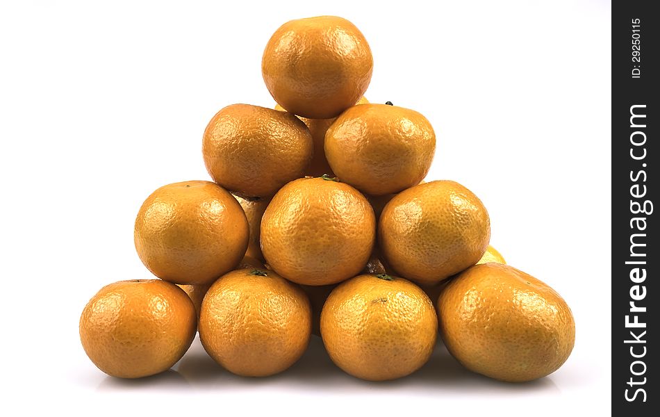 A pile of fresh citrus fruit, mandarins, photography for further processing and use of advertising space. A pile of fresh citrus fruit, mandarins, photography for further processing and use of advertising space