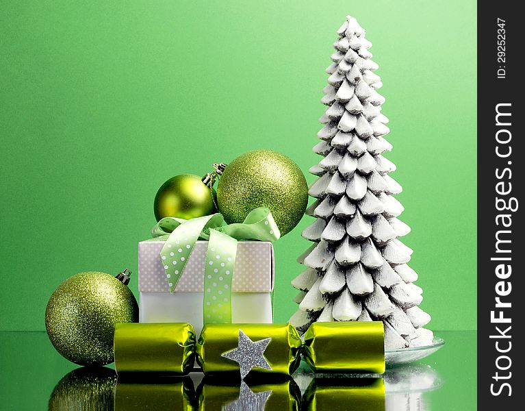 Green theme Christmas gift and bauble decorations festive holiday still life.