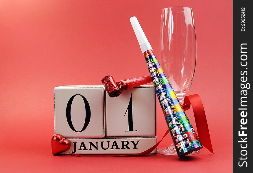 Red theme Save the date with a Happy New Year, January 1, block calendar, with champagne glass and party whistles.