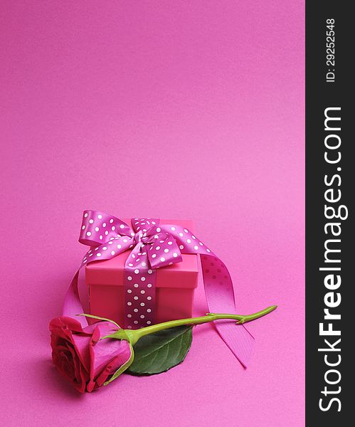 Pink Polka Dot Gift With Rose - Vertical With Copy Space.