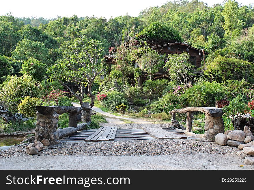 Wooden bridge walkway through home in the forest