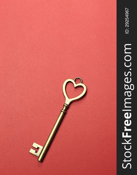 One heart shape gold key - vertical.