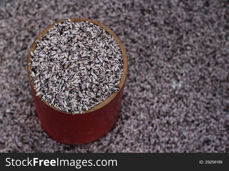 Unpolished rice in a cup for selling at market