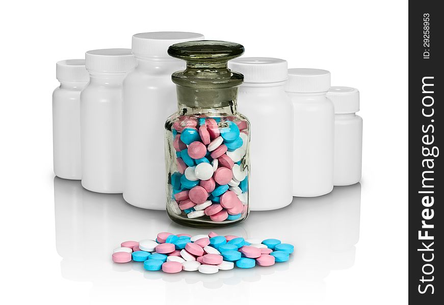 Pills, plastic small bottles and a glass vial on a white background. Pills, plastic small bottles and a glass vial on a white background