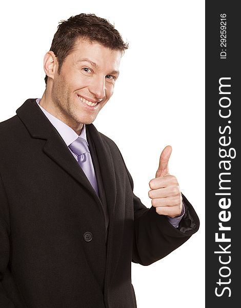 Sucefull smiling businessman in coat showing thumbs up on white background. Sucefull smiling businessman in coat showing thumbs up on white background