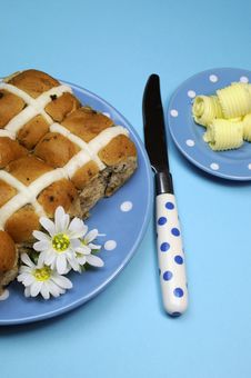 Hot Cross Buns With Butter Curls On Blue Background - Vertical Aerial. Royalty Free Stock Image