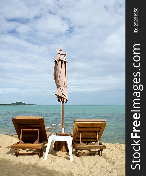 Chairs and umbrella on tropical beach