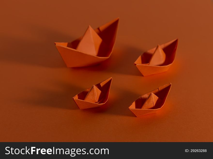 Group of origami boat on backgorund with shadow and copy space. Group of origami boat on backgorund with shadow and copy space